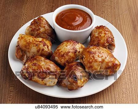 Stock Photography - Shish Tawook marinated chicken pieces with dipping sauce. Fotosearch