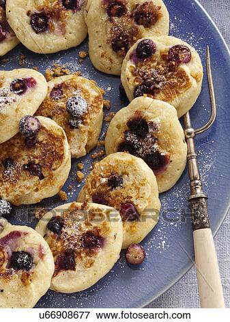 Stock Photo - Silver dollar ginger snap Huckelberry pancakes. Fotosearch