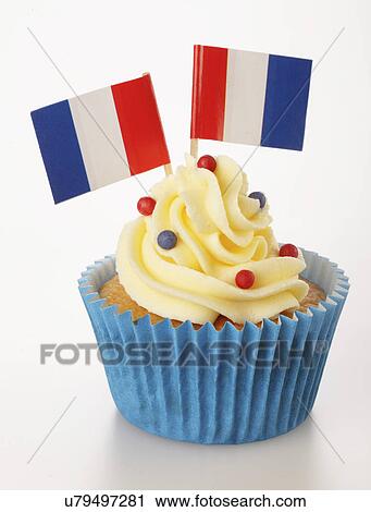 Single Cupcake With Two French Flags And Buttercream Topping, In Blue Cake Case, White Background View Large Photo Image Stock Image - Single Cupcake With Two French Flags And Buttercream Topping, In Blue Cake Case, White Background. Fotosearch