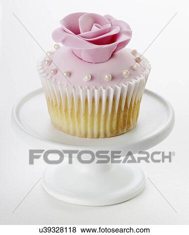 Single Pastel Pink Cupcake With Rose And Pearl Decoration On