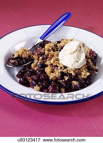 Single Serving Of Blueberry Crumble In Dish With Ice Cream Topping View Large Photo Image Stock Photo - Single Serving Of Blueberry Crumble In Dish With Ice Cream Topping. Fotosearch