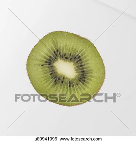 Stock Photograph - Slice Of Kiwi Fruit On White Background. Fotosearch
