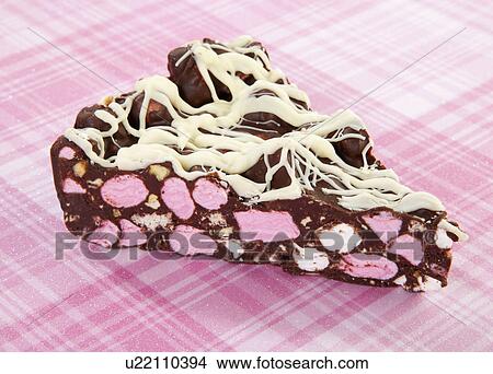 Slice Of Rocky Road Chocolate Marshmallow Fridge Cake On Pink Tabletop View Large Photo Image Picture - Slice Of Rocky Road Chocolate Marshmallow Fridge Cake On Pink Tabletop. Fotosearch