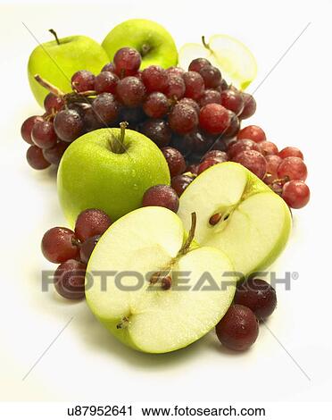 Stock Image - Sliced Apple And Grapes On White Background. Fotosearch