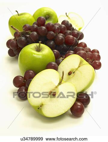 Sliced Apple And Grapes On White Background View Large Photo Image Stock Photo - Sliced Apple And Grapes On White Background. Fotosearch