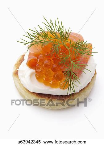 Smoked salmon roe sour cream dill blini View Large Photo Image Stock Photography - Smoked salmon roe sour cream dill blini. Fotosearch