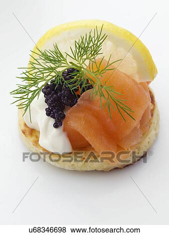 Smoked salmon sour cream dill blini View Large Photo Image Stock Photo - Smoked salmon sour cream dill blini. Fotosearch