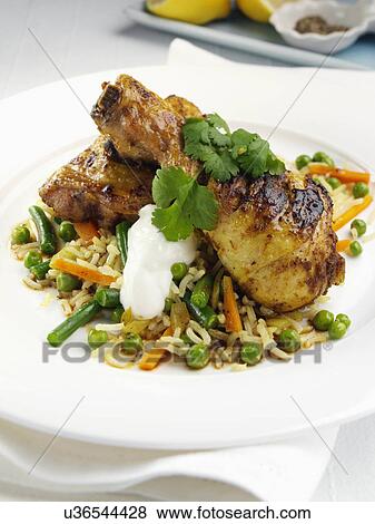 Spiced chicken legs with basmati rice and steamed vegetables View Large Photo Image Stock Photo - Spiced chicken legs with basmati rice and steamed vegetables. Fotosearch