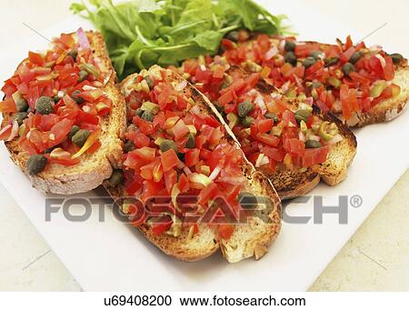 Square Plate With Bruschetta: Slices Of Crispy Bread Topped With Chopped Tomatoes, Garlic, Olice Oil And Capers, Rocket Leaves Garnish View Large Photo Image Stock Image - Square Plate With Bruschetta: Slices Of Crispy Bread Topped With Chopped Tomatoes, Garlic, Olice Oil And Capers, Rocket Leaves Garnish. Fotosearch