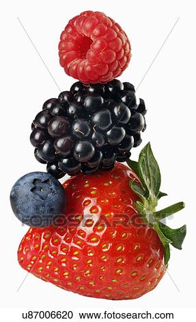 Stock Image - Stack Of Four Summer Fruit Berries On White: Raspberry, Strawberry, Blueberry And Blackberry. Fotosearch