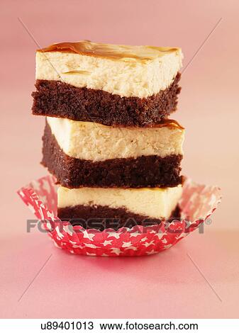 Stack Of Three Brownie Cheesecake Pieces On Pink View Large Photo Image Stock Image - Stack Of Three Brownie Cheesecake Pieces On Pink. Fotosearch