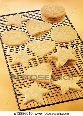Star And Heart Shaped Cookies On Cooling Rack, Ready For Decorating View Large Photo Image Stock Image - Star And Heart Shaped Cookies On Cooling Rack, Ready For Decorating. Fotosearch