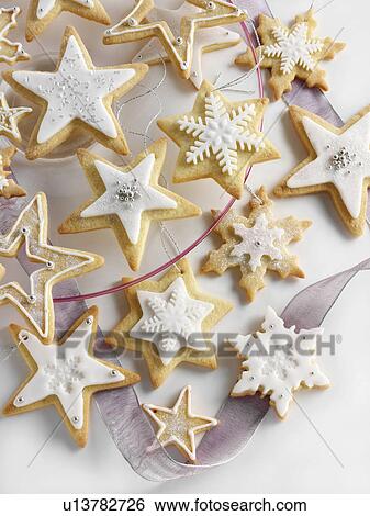 Star shaped iced Christmas biscuits View Large Photo Image Stock Photograph - Star shaped iced Christmas biscuits. Fotosearch