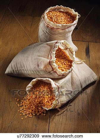 Still life red split lentils with sacks View Large Photo Image Stock Photo - Still life red split lentils with sacks. Fotosearch