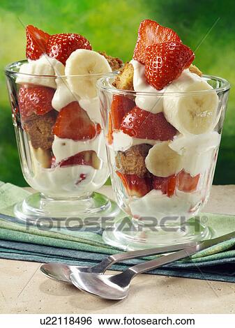 Stock Photograph - Strawberry banana parfaits with banana bread croutons. Fotosearch