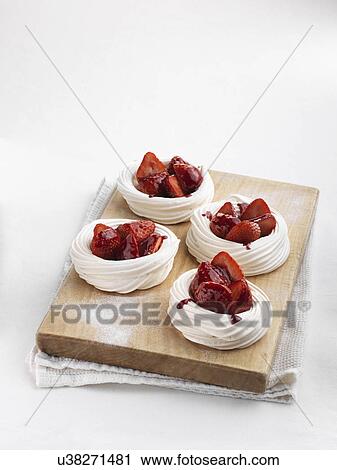 Stock Image - Strawberry meringue nests. Fotosearch