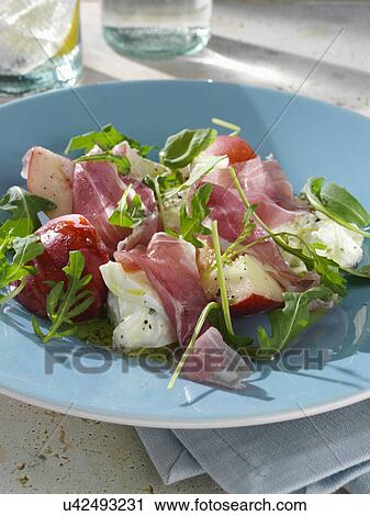 Stock Image - Summer salad burrito fresh peach and prosciutto ham. Fotosearch