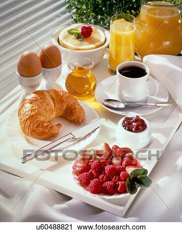 Sunlit Breakfast Tray With Fresh Brewed Coffee In Cup, Orange Juice, Grapefruit Half With Cherry, Bowl Of Strawberries, Croissant And Fruit Jam Or Preserve View Large Photo Image Stock Image - Sunlit Breakfast Tray With Fresh Brewed Coffee In Cup, Orange Juice, Grapefruit Half With Cherry, Bowl Of Strawberries, Croissant And Fruit Jam Or Preserve. Fotosearch