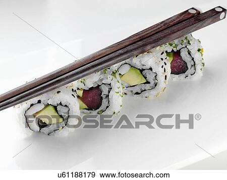 Sushi and chopsticks View Large Photo Image Stock Photo - Sushi and chopsticks. Fotosearch