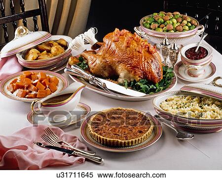 Stock Photography - Thanksgiving Holiday Dinner With Turkey, Vegetables And Pecan Pie. Fotosearch