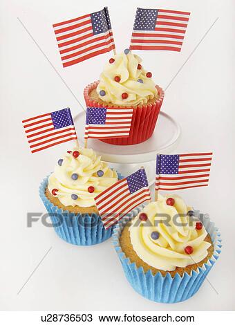 Stock Photo Of Three Cupcakes In Red And Blue Cases Decorated With Stock Photo Of Three Cupcakes In Red And Blue Cases Decorated With