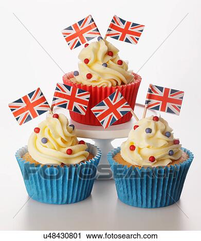 Three Themed British Celebration Cupcakes, Red And Blue Cake Case Filled With Sponge Cake, Topped With Buttercream Red And Blue Sprinkles And Small Union Jack Flags, On White View Large Photo Image Stock Image - Three Themed British Celebration Cupcakes, Red And Blue Cake Case Filled With Sponge Cake, Topped With Buttercream Red And Blue Sprinkles And Small Union Jack Flags, On White. Fotosearch