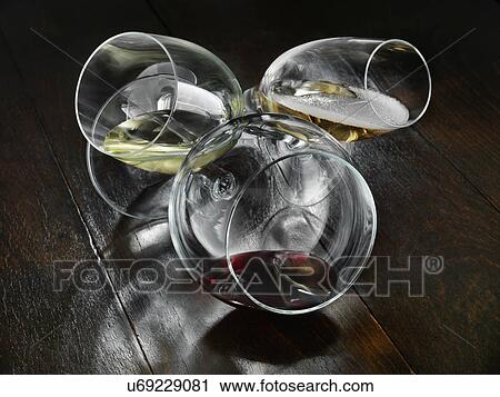 Three wine glasses on a table View Large Photo Image Stock Image - Three wine glasses on a table. Fotosearch