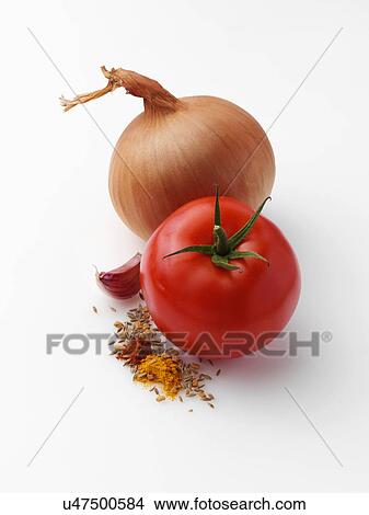Picture - Tomato onion garlic fenugreek cumin turmeric chili powder. Fotosearch