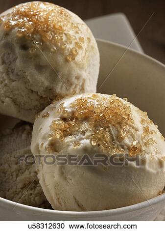 Stock Image - Turbinado sugar and ginger ice cream. Fotosearch