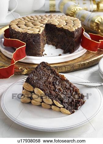 Stock Photo - UK Christmas cake on a cake stand. Fotosearch