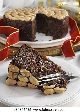 UK Christmas cake with a slice in front View Large Photo Image Stock Photography - UK Christmas cake with a slice in front. Fotosearch