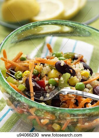 Stock Image - Vegetarian quinoa salad with peas carrots celery red kidney beans. Fotosearch