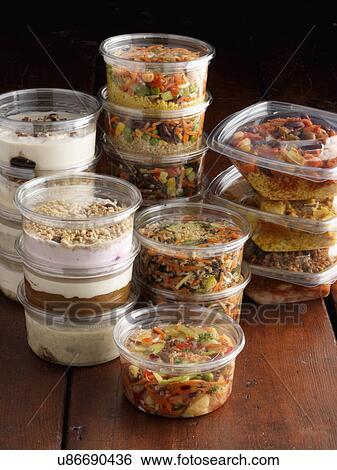 Stock Photograph - Vegetarian salads and desserts. Fotosearch