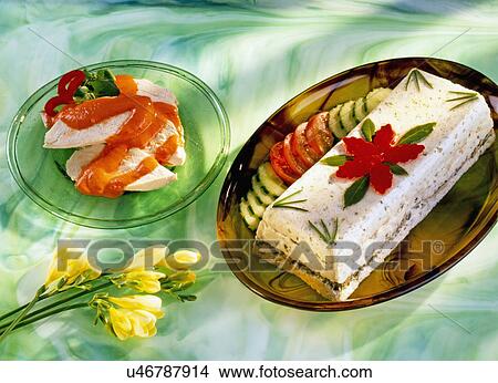 Vegetarian Terrine Garnished With Tomato And Cucumber Sloces, Yellow Fresia Flowers On Green Swirly Tabletop View Large Photo Image Picture - Vegetarian Terrine Garnished With Tomato And Cucumber Sloces, Yellow Fresia Flowers On Green Swirly Tabletop. Fotosearch