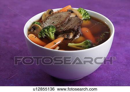 White Bowl Filled With Beef, Carrots And Broccoli Stew, On Purple Tabletop View Large Photo Image Stock Photograph - White Bowl Filled With Beef, Carrots And Broccoli Stew, On Purple Tabletop. Fotosearch