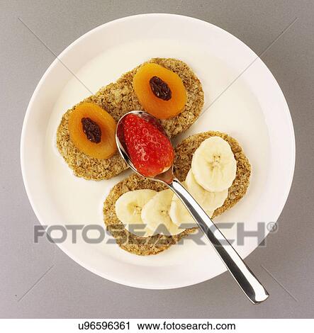 White Bowl With Wholewheat Breakfast Cereal, Decorated With Fruit In Shape Of Face View Large Photo Image Stock Image - White Bowl With Wholewheat Breakfast Cereal, Decorated With Fruit In Shape Of Face. Fotosearch