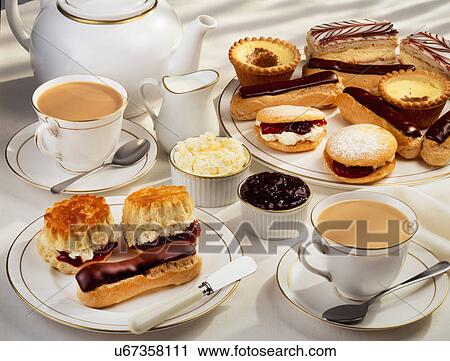 White Tabletop With Teaopt, Two Cups Of Tea And Selection Of Fresh Cream Cakes And Scones With Clotted Cream And Jam Preserve View Large Photo Image Stock Image - White Tabletop With Teaopt, Two Cups Of Tea And Selection Of Fresh Cream Cakes And Scones With Clotted Cream And Jam Preserve. Fotosearch