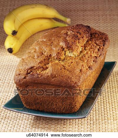 Whole Banana Walnut Bread Or Loaf On Tabletop With Fresh Bananas In Background View Large Photo Image Picture - Whole Banana Walnut Bread Or Loaf On Tabletop With Fresh Bananas In Background. Fotosearch