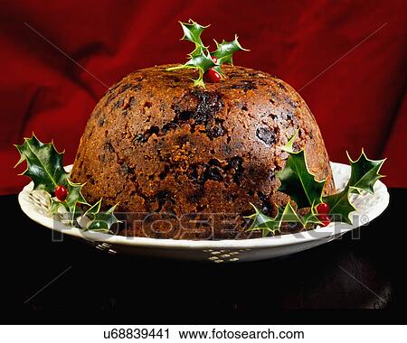 Whole Christmas Pudding On Plate Decorated With Holly Sprigs View Large Photo Image Stock Image - Whole Christmas Pudding On Plate Decorated With Holly Sprigs. Fotosearch