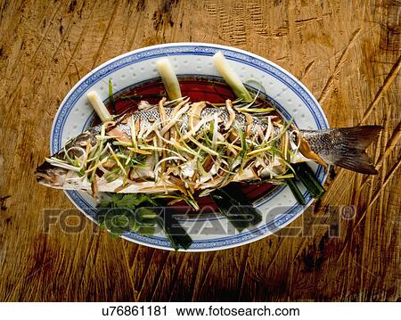 Whole Fish Cooked Chinese Style, Served In Oval Dish With Vegetable Garnish View Large Photo Image Stock Image - Whole Fish Cooked Chinese Style, Served In Oval Dish With Vegetable Garnish. Fotosearch