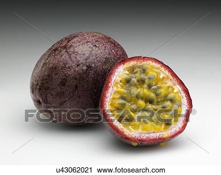 Whole passion fruit and half cut with seeds View Large Photo Image Stock Image - Whole passion fruit and half cut with seeds. Fotosearch