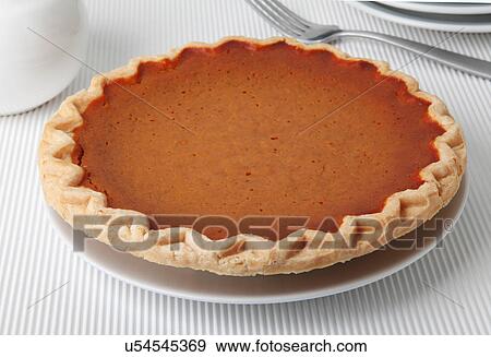 Whole Pumpkin Pie On White Tabletop View Large Photo Image Stock Photo - Whole Pumpkin Pie On White Tabletop. Fotosearch