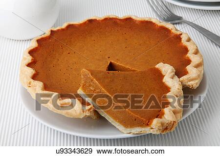 Whole Pumpkin Pie With Cut Slice On White Tabletop View Large Photo Image Stock Photo - Whole Pumpkin Pie With Cut Slice On White Tabletop. Fotosearch
