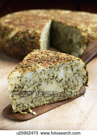 Whole Spinach tortilla with a slice in front View Large Photo Image Stock Image - Whole Spinach tortilla with a slice in front. Fotosearch