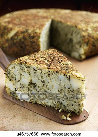 Whole Spinach tortilla with a slice in front View Large Photo Image Stock Photo - Whole Spinach tortilla with a slice in front. Fotosearch