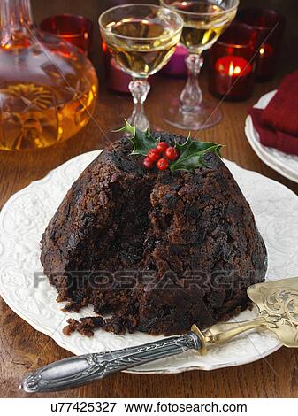 Whole Xmas pudding with brandy decanter and glasses in the background View Large Photo Image Stock Photo - Whole Xmas pudding with brandy decanter and glasses in the background. Fotosearch