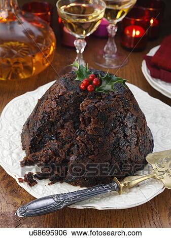 Whole Xmas pudding with brandy decanter and glasses in the background View Large Photo Image Stock Photograph - Whole Xmas pudding with brandy decanter and glasses in the background. Fotosearch