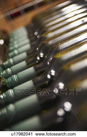 Stock Image - Wine Bottles Being Stored In Cellar. Fotosearch