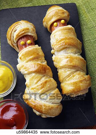 Stock Photography - Wrapped frankfurter sausages. Fotosearch