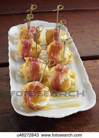 Stock Image - Zeppole fluffy savoury Italian beignets. Fotosearch